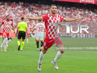 Abel Ruiz of Girona FC celebrates a goal during the La Liga EA Sports match between Sevilla FC and Girona CF at Nuevo Mirandilla in Seville,...