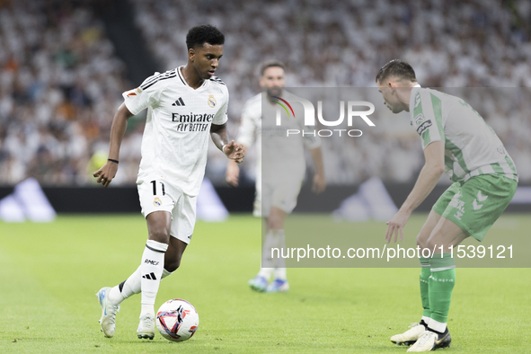 Rodrygo Goes of Real Madrid plays during the La Liga 2024/25 match between Real Madrid and Real Betis at Santiago Bernabeu Stadium in Madrid...