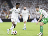 Rodrygo Goes of Real Madrid plays during the La Liga 2024/25 match between Real Madrid and Real Betis at Santiago Bernabeu Stadium in Madrid...