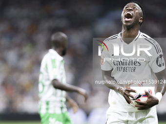 Vinicius Jr of Real Madrid reacts to a missed opportunity during the La Liga 2024/25 match between Real Madrid and Real Betis at Santiago Be...