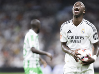 Vinicius Jr of Real Madrid reacts to a missed opportunity during the La Liga 2024/25 match between Real Madrid and Real Betis at Santiago Be...