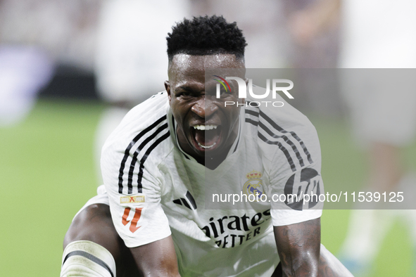 Vinicius Jr of Real Madrid reacts to a missed opportunity during the La Liga 2024/25 match between Real Madrid and Real Betis at Santiago Be...