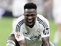 Vinicius Jr of Real Madrid reacts to a missed opportunity during the La Liga 2024/25 match between Real Madrid and Real Betis at Santiago Be...