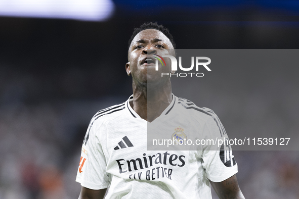 Vinicius Jr of Real Madrid reacts to a missed opportunity during the La Liga 2024/25 match between Real Madrid and Real Betis at Santiago Be...