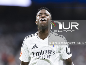 Vinicius Jr of Real Madrid reacts to a missed opportunity during the La Liga 2024/25 match between Real Madrid and Real Betis at Santiago Be...