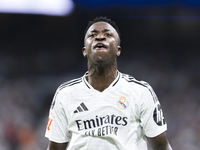 Vinicius Jr of Real Madrid reacts to a missed opportunity during the La Liga 2024/25 match between Real Madrid and Real Betis at Santiago Be...