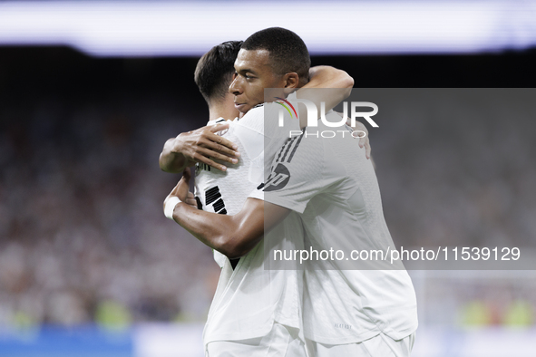 Kylian Mbappe of Real Madrid and Brahim Diaz of Real Madrid celebrate a goal during the La Liga 2024/25 match between Real Madrid and Real B...