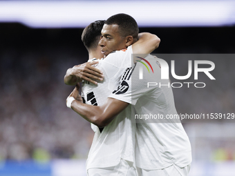 Kylian Mbappe of Real Madrid and Brahim Diaz of Real Madrid celebrate a goal during the La Liga 2024/25 match between Real Madrid and Real B...