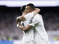 Kylian Mbappe of Real Madrid and Brahim Diaz of Real Madrid celebrate a goal during the La Liga 2024/25 match between Real Madrid and Real B...