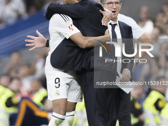 Real Madrid coach Carlo Ancelotti and Kylian Mbappe of Real Madrid hug each other during the La Liga 2024/25 match between Real Madrid and R...