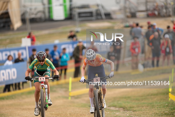 Puck Pieterse of the Netherlands and Candice Lill of South Africa participate in the UCI Mountain Bike World Championships Women in Pal Arin...