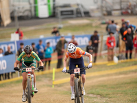 Puck Pieterse of the Netherlands and Candice Lill of South Africa participate in the UCI Mountain Bike World Championships Women in Pal Arin...