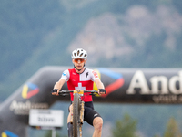 Dario Lillo of Switzerland crosses the finish line in the UCI Mountain Bike World Championships Men Under 23 Race in Pal Arinsal, Andorra, o...