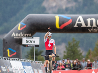 Dario Lillo of Switzerland crosses the finish line in the UCI Mountain Bike World Championships Men Under 23 Race in Pal Arinsal, Andorra, o...