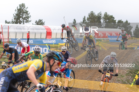 A cyclist participates in the UCI Mountain Bike World Championships Men Under 23 Race in Pal Arinsal, Andorra, on September 1, 2024. 