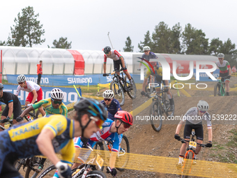 A cyclist participates in the UCI Mountain Bike World Championships Men Under 23 Race in Pal Arinsal, Andorra, on September 1, 2024. (