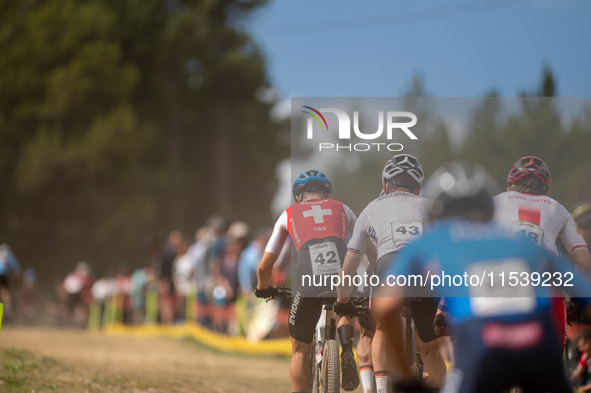 A cyclist participates in the UCI Mountain Bike World Championships Men in Pal Arinsal, Andorra, on September 1, 2024. 