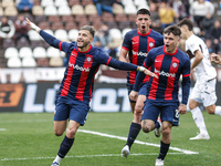 Ivan Leguizamon of San Lorenzo celebrates with his teammates after scoring the first goal of his team during a match between Platense and Sa...