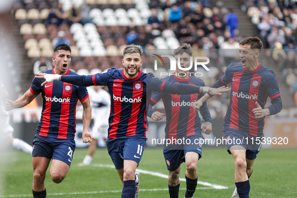 Ivan Leguizamon of San Lorenzo celebrates with his teammates after scoring the first goal of his team during a match between Platense and Sa...