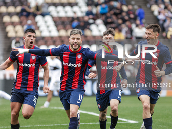 Ivan Leguizamon of San Lorenzo celebrates with his teammates after scoring the first goal of his team during a match between Platense and Sa...