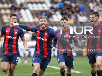 Ivan Leguizamon of San Lorenzo celebrates with his teammates after scoring the first goal of his team during a match between Platense and Sa...