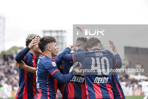 Ivan Leguizamon of San Lorenzo celebrates with his teammates after scoring the first goal of his team during a match between Platense and Sa...