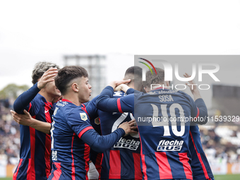 Ivan Leguizamon of San Lorenzo celebrates with his teammates after scoring the first goal of his team during a match between Platense and Sa...