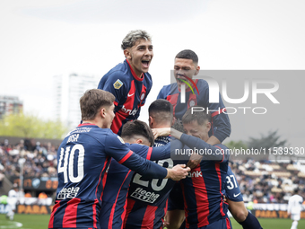 Ivan Leguizamon of San Lorenzo celebrates with his teammates after scoring the first goal of his team during a match between Platense and Sa...