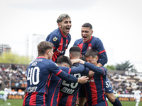 Ivan Leguizamon of San Lorenzo celebrates with his teammates after scoring the first goal of his team during a match between Platense and Sa...