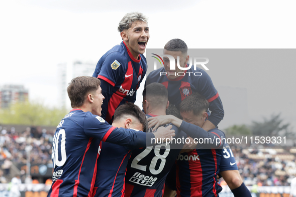 Ivan Leguizamon of San Lorenzo celebrates with his teammates after scoring the first goal of his team during a match between Platense and Sa...