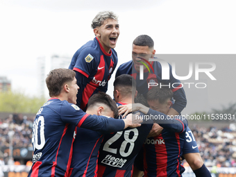 Ivan Leguizamon of San Lorenzo celebrates with his teammates after scoring the first goal of his team during a match between Platense and Sa...