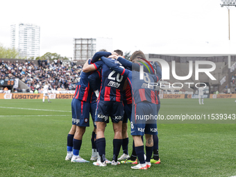 Ivan Leguizamon of San Lorenzo celebrates with his teammates after scoring the first goal of his team during a match between Platense and Sa...