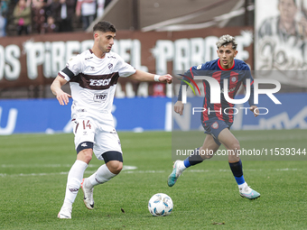 Leonel Picco of Platense and Elian Irala of San Lorenzo are in action during the match between Platense and San Lorenzo as part of Liga Prof...