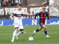 Leonel Picco of Platense and Elian Irala of San Lorenzo are in action during the match between Platense and San Lorenzo as part of Liga Prof...