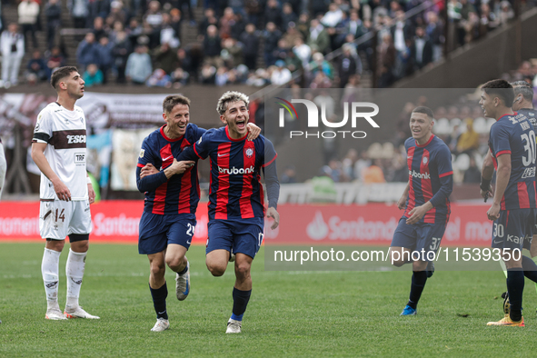 Elian Irala of San Lorenzo celebrates with his teammates after scoring the second goal of his team during a match between Platense and San L...