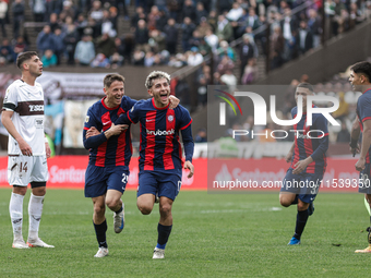 Elian Irala of San Lorenzo celebrates with his teammates after scoring the second goal of his team during a match between Platense and San L...