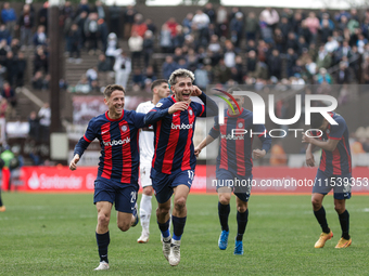 Elian Irala of San Lorenzo celebrates with his teammates after scoring the second goal of his team during a match between Platense and San L...