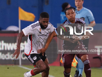 FC Dallas midfielder Ruan Gregorio Teixeira #5 and Colorado Rapids defender Jackson Travis #99 battle for the ball during the MLS match betw...