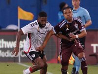 FC Dallas midfielder Ruan Gregorio Teixeira #5 and Colorado Rapids defender Jackson Travis #99 battle for the ball during the MLS match betw...