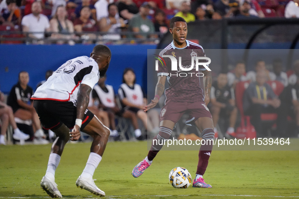 Colorado Rapids midfielder Calvin Harris #14 drives the ball during the MLS match between FC Dallas and Colorado Rapids at Toyota Stadium in...