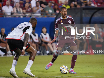 Colorado Rapids midfielder Calvin Harris #14 drives the ball during the MLS match between FC Dallas and Colorado Rapids at Toyota Stadium in...