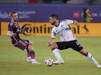 FC Dallas forward Sebastian Lletget #8 drives the ball against Connor Ronan #20 of Colorado Rapids during the MLS match between FC Dallas an...