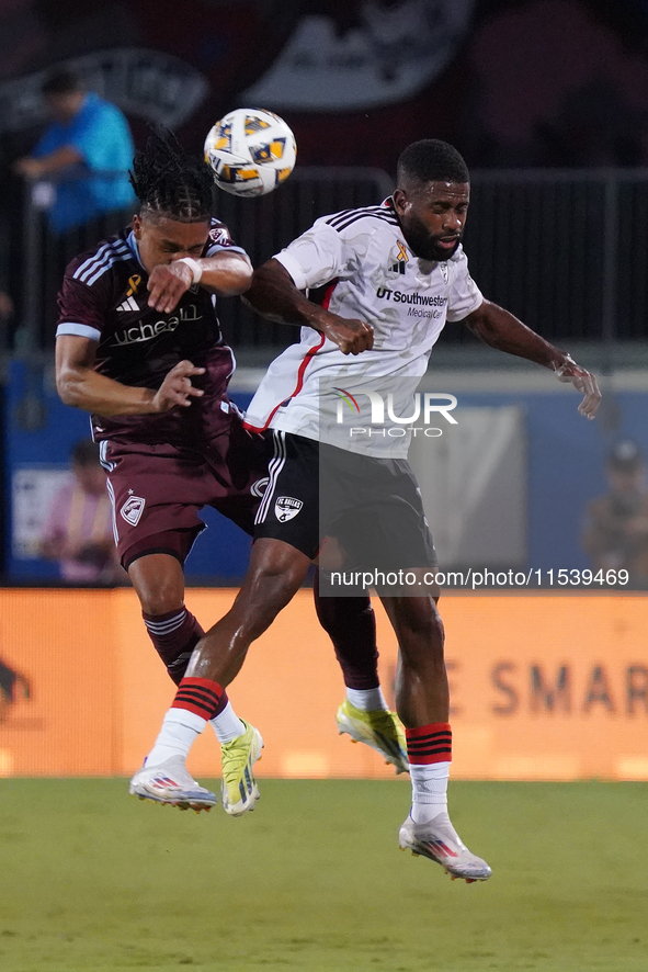 Colorado Rapids midfielder Jackson Travis #99 and FC Dallas midfielder Ruan Gregorio Teixeira #5 head for the ball during the MLS match betw...