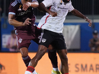 Colorado Rapids midfielder Jackson Travis #99 and FC Dallas midfielder Ruan Gregorio Teixeira #5 head for the ball during the MLS match betw...