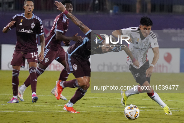 FC Dallas defender Marco Farfan #4 and Colorado Rapids forward Rafael Navarro #9 battle for the ball during the MLS match between FC Dallas...