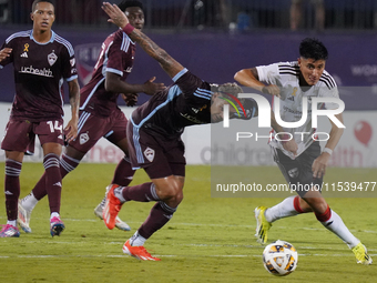 FC Dallas defender Marco Farfan #4 and Colorado Rapids forward Rafael Navarro #9 battle for the ball during the MLS match between FC Dallas...