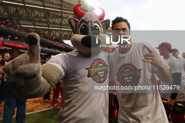 Rocco Mascot and Santiago Harp, vice president of Diablos Rojos, celebrate after winning the South Zone 2024 championship series of the Mexi...