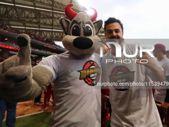 Rocco Mascot and Santiago Harp, vice president of Diablos Rojos, celebrate after winning the South Zone 2024 championship series of the Mexi...