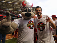 Rocco Mascot and Santiago Harp, vice president of Diablos Rojos, celebrate after winning the South Zone 2024 championship series of the Mexi...