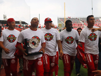 Robinson Cano #22 of Diablos Rojos holds the trophy after winning the South Zone 2024 championship series of the Mexican Baseball League (LM...